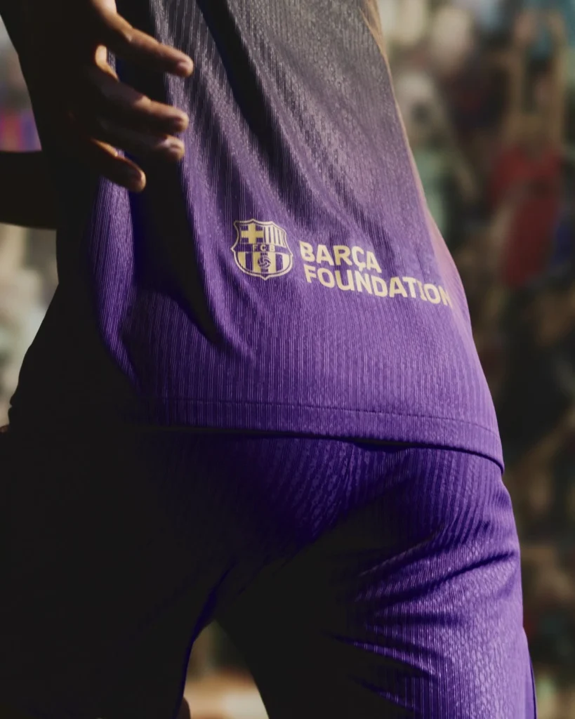 Why is the FC Barcelona 26/27 away kit purple and black